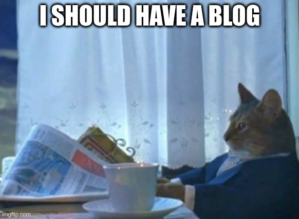 meme de gato de traje leyendo un diario, texto &ldquo;I should have a blog&rdquo;